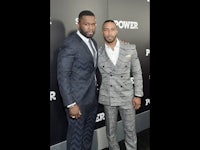 two men posing for a photo at the power premiere